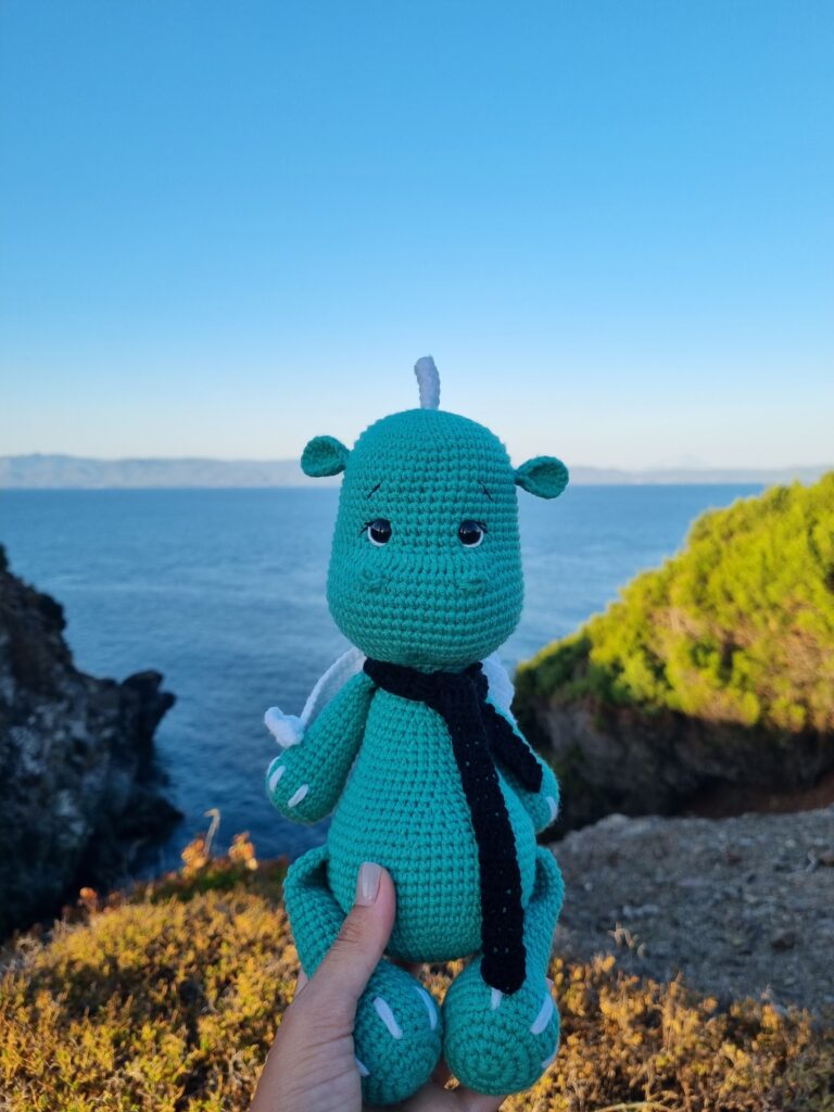 Crocheted dragon with scarf